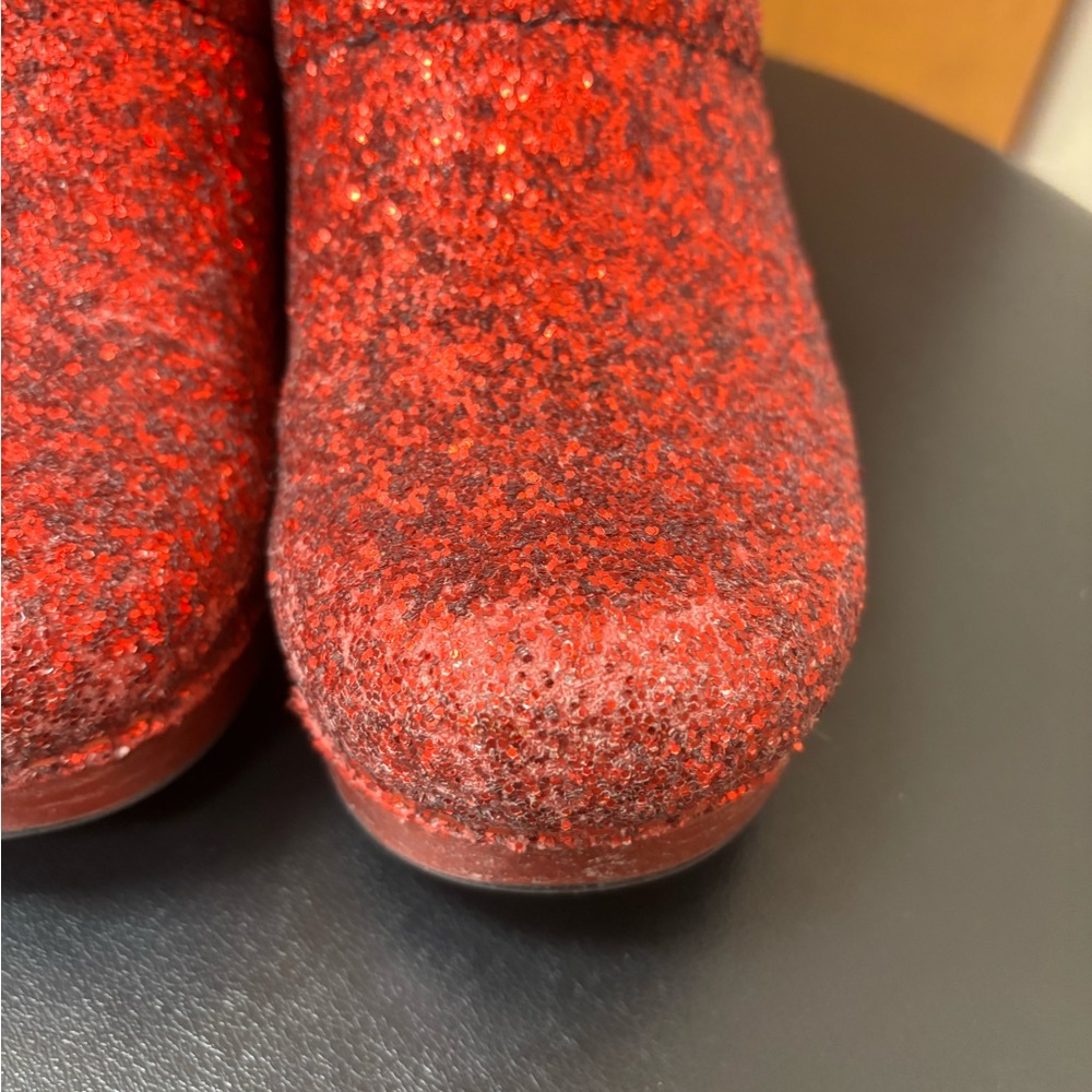 Dansko women's red glitter slip on clogs